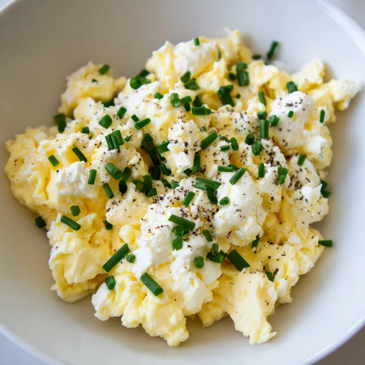 Freshly made Cottage Cheese Scrambled Eggs, cooked in butter, promising a protein-rich and satisfying meal.