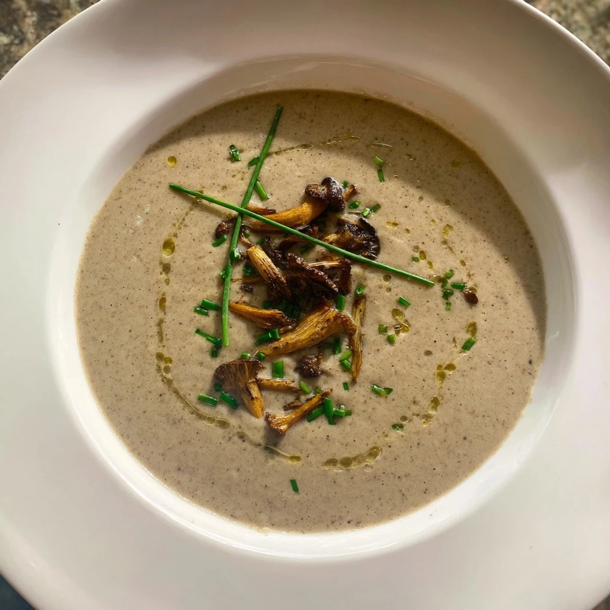A close-up shot of rich, velvety Creamy Mushroom Bisque, showcasing its appealing texture.