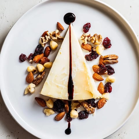 A stunning The Sundial cheese board: Aged hard cheese and nut clusters displayed beautifully.