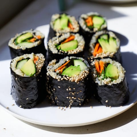 Perfectly rolled Avocado Cucumber Sushi, ready to be sliced, offering fresh, vibrant flavors and textures.