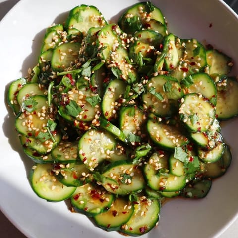 Vivid image of Zesty Cucumber Salad with crunchy cucumbers scattered across a bowl, tempting flavors present.