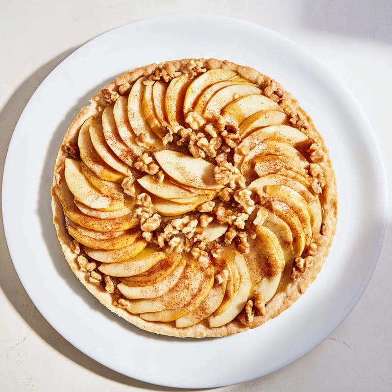 Warm and inviting, the lattice orchard pie showcases a woven apple design with glistening honey.