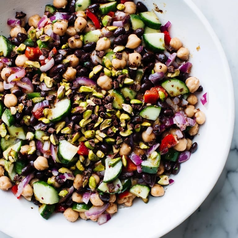 Close-up of a colorful Dense Bean Salad with Dubai Chocolate Notes, showcasing fresh herbs and textures.