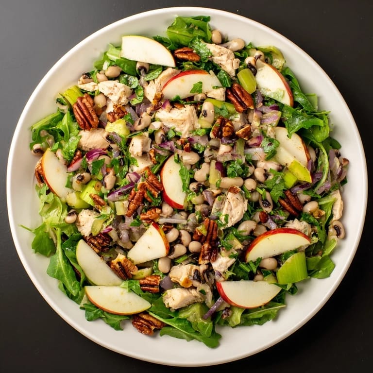 Fresh Chicken and Apple New Years Luck Salad featuring crisp apples, making a vibrant, healthy meal.