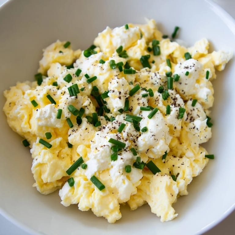 Freshly made Cottage Cheese Scrambled Eggs, cooked in butter, promising a protein-rich and satisfying meal.