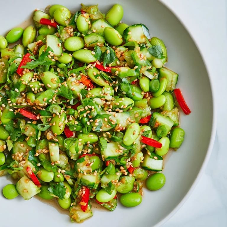 A colorful bowl of fresh edamame salad, ready to eat with a flavorful Asian twist.