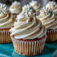 Cancer Birthday Cupcakes feature delicate vanilla cake and shimmering pearl fondant toppers.